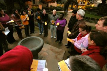 Jesuit with students linking to campus ministry